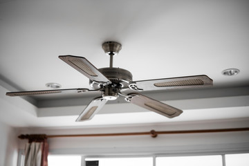 Picture of wooden ceiling fan inside the living room.