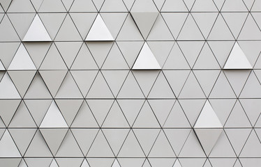 Silver geometric wall background with triangles.