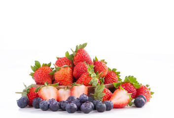 A bowl set of beautiful and delicious strawberry and blueberry isolated on white background, close up, copy space, clipping path, cut out.