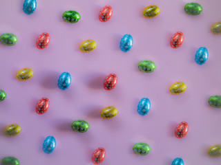 Easter eggs pattern on pink background