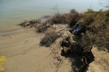Thatta, Pakistan - April, 2018 : Sea Erosion in Keti Bandar Area of Thatta Sindh, Boats Fisher Man in Sea, Poor Huts Condition of People 