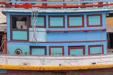Fototapeta na wymiar Traditional Thai fishing boat close-up side-view, Koh Phangan island, Thailand.