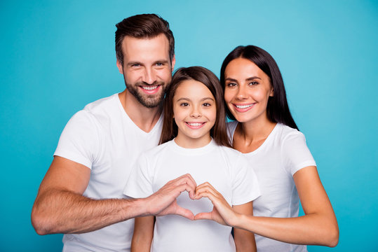 Photo of adopted family taking care of little daughter show heart figure wear casual outfit isolated blue background