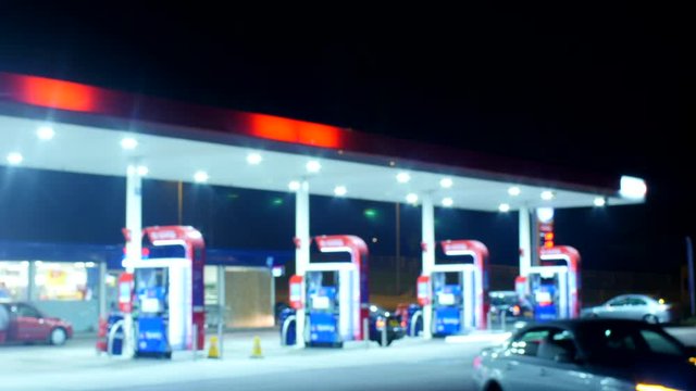 Timelapse Of British Petrol Station At Night Time, People Putting Petrol In Their Car
