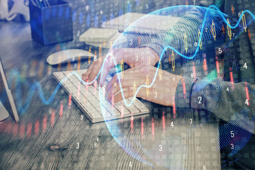 Multi exposure of financial graph with man works in office on background. Concept of analysis.