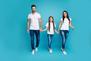 Fototapeta premium Full body photo of daddy mommy and small lady walking down street to zoo wear casual outfit isolated blue background