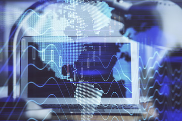 Stock market chart hologram drawn on personal computer background. Double exposure. Concept of investment.