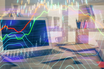 Financial market graph hologram and personal computer on background. Multi exposure. Concept of forex.