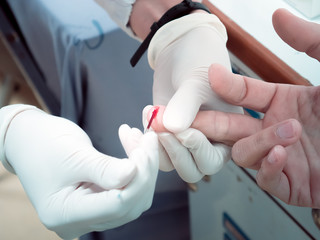 A nurse drawing a blood from donor for test before blood donation