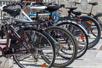 Fototapeta na wymiar Bicycles parked in a row in a bicycle parking lot