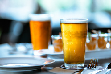 Glass of beer on the table in a food time