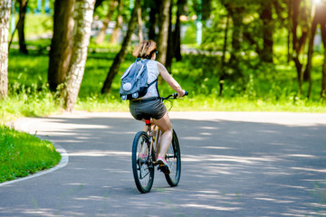 Naklejka premium Cyclist ride on the bike path in the city Park 
