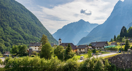 Panorama with buildings, main Road and Parish Church inside Mountain Landscape of Village Log pod...