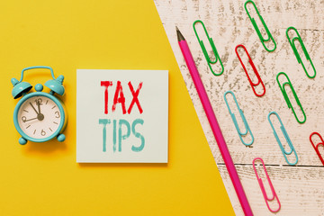 Handwriting text Tax Tips. Conceptual photo compulsory contribution to state revenue levied by...