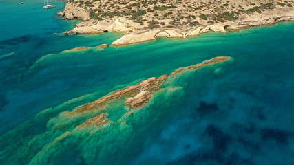 Aerial drone photo of Laki paradise beach with beautiful emerald and turquoise sea and small volcanic bays, Kato Koufonisi, Small Cyclades, Greece