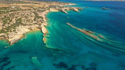 Aerial drone photo of Laki paradise beach with beautiful emerald and turquoise sea and small volcanic bays, Kato Koufonisi, Small Cyclades, Greece