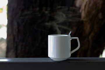 Coffee in a white cup on the table