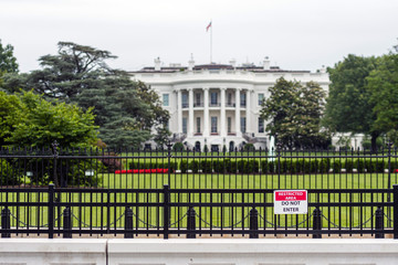 Fototapeta na wymiar Barriers and fencing in front of the White House in Washington DC - image