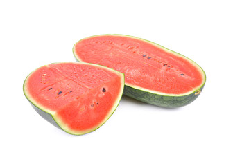 half and portion cut watermelon with seeds on white background