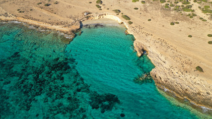 Fototapeta na wymiar Aerial drone photo of turquoise paradise beaches of Kato Koufonisi island main Chora and church of Panagia, Small Cyclades, Greece