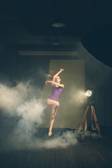 Fototapeta na wymiar .Dancer, gymnast in a beautiful studio light