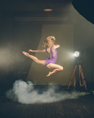 .Dancer, gymnast in a beautiful studio light