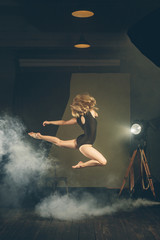 .Dancer, gymnast in a beautiful studio light