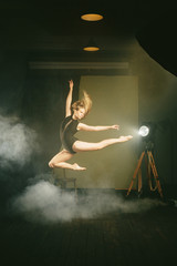 .Dancer, gymnast in a beautiful studio light