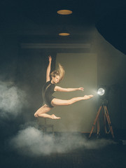 .Dancer, gymnast in a beautiful studio light