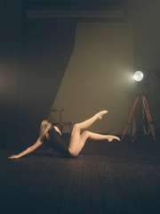 .Dancer, gymnast in a beautiful studio light
