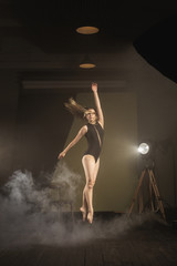 .Dancer, gymnast in a beautiful studio light