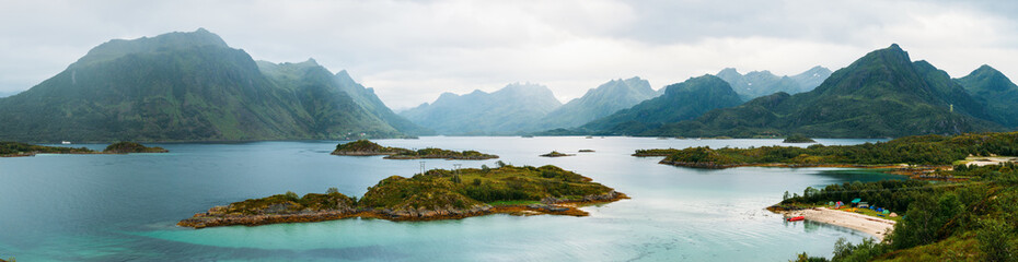 Panoramic photo of picturesque highlands, sea, cloudy sky in Norway