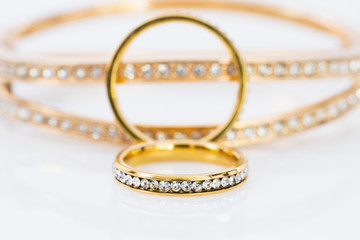 Gold wedding rings on white background