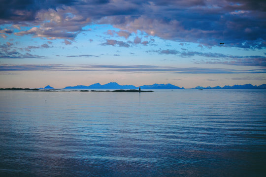 Photo of hills, sea, sky in Norway at sunset