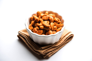 Masala Kaju or spicy Cashew in a bowl. Popular festival snack from India/asia, also known as Chakna recipe