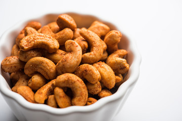 Masala Kaju or spicy Cashew in a bowl. Popular festival snack from India/asia, also known as Chakna recipe