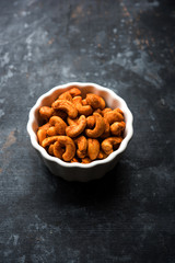 Masala Kaju or spicy Cashew in a bowl. Popular festival snack from India/asia, also known as Chakna recipe