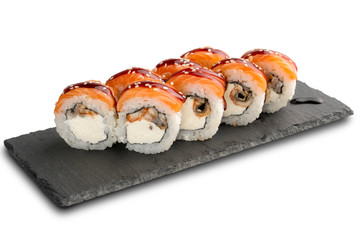 Sushi Rolls with eel and salmon and Cream Cheese inside on black slate or stone shale surface isolated