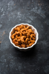Masala Kaju or spicy Cashew in a bowl. Popular festival snack from India/asia, also known as Chakna recipe