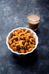 Masala Kaju or spicy Cashew in a bowl. Popular festival snack from India/asia, also known as Chakna recipe