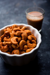Masala Kaju or spicy Cashew in a bowl. Popular festival snack from India/asia, also known as Chakna recipe