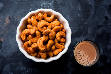Masala Kaju or spicy Cashew in a bowl. Popular festival snack from India/asia, also known as Chakna...