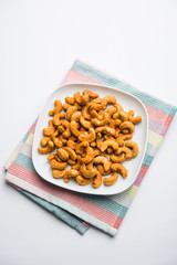 Masala Kaju or spicy Cashew in a bowl. Popular festival snack from India/asia, also known as Chakna recipe