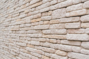 Old grunge brown stone brick wall texture abstract background.