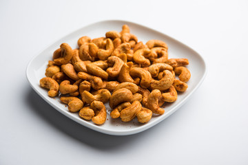 Masala Kaju or spicy Cashew in a bowl. Popular festival snack from India/asia, also known as Chakna recipe