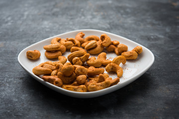 Masala Kaju or spicy Cashew in a bowl. Popular festival snack from India/asia, also known as Chakna recipe