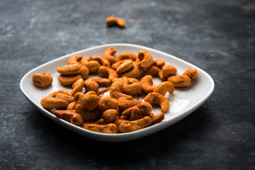 Masala Kaju or spicy Cashew in a bowl. Popular festival snack from India/asia, also known as Chakna recipe