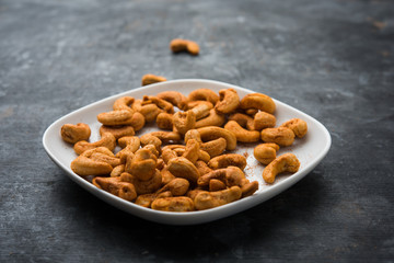 Masala Kaju or spicy Cashew in a bowl. Popular festival snack from India/asia, also known as Chakna recipe