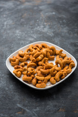 Masala Kaju or spicy Cashew in a bowl. Popular festival snack from India/asia, also known as Chakna recipe