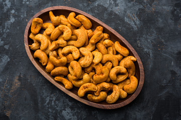 Masala Kaju or spicy Cashew in a bowl. Popular festival snack from India/asia, also known as Chakna recipe